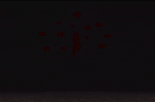 a person is laying on their stomach on a bed with a blue light shining on their chest .