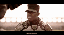 a man in a military uniform says " qué hay del scarab " in spanish