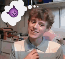 a young man is smiling with a purple emoji in a thought bubble .