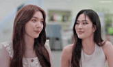 two women are looking at each other with a watermark that says lindorndiffs