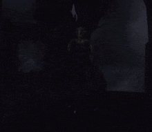 a statue with a spear in the dark