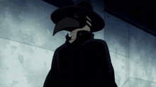 a person wearing a black hat with a bird on it