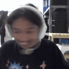 a person wearing ear muffs and a black shirt
