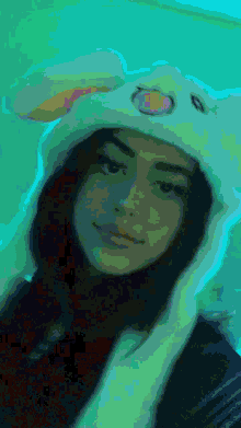 a pixelated image of a girl wearing bunny ears