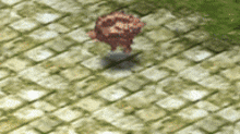 a blurred image of a brick walkway with a statue in the middle of it .