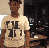 a man wearing a t-shirt that says " new kids inc "