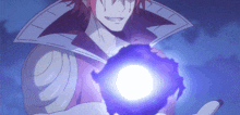 a man with red hair is holding a purple object