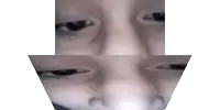 a close up of a person 's face with an arrow pointing down .