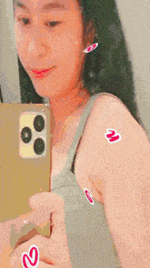 a woman taking a picture of herself in the mirror