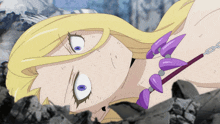a woman with purple eyes and a purple necklace is laying on the ground
