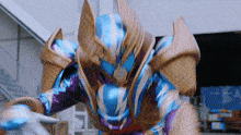 a close up of a robot with a purple and blue armor