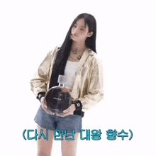 a woman holding a large bottle of chance perfume