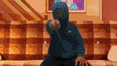 a person wearing a blue nike hoodie is pointing