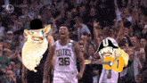 a celtics player wearing a top hat and a guitar stands in front of a crowd