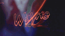 a man is playing a guitar in front of the word wesna