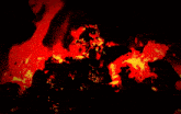 a silhouette of a person standing in a fire