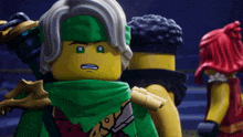a lego character with a green scarf around his neck and a sword