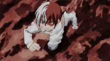 a boy with half red and half white hair is crawling through a hole .