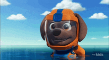 a cartoon dog is wearing a helmet and swimming in the ocean .