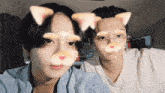 a man and a woman are wearing cat ears on their faces