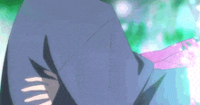 a close up of a person 's arm with a blue hood on