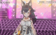 a girl with a cat ear is standing on a stage in front of a sign that says stream
