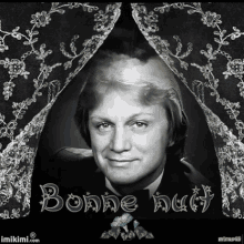 a black and white photo of a man with the words bonne nuit