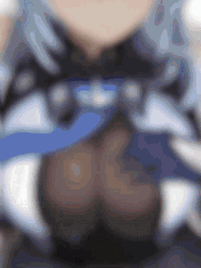 a blurry picture of a person 's chest with a blue and white pattern
