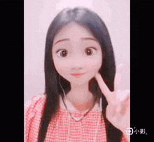 a girl wearing headphones and a red plaid shirt is giving a peace sign .