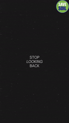 a black background with the words stop looking back written on it
