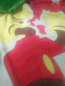 a close up of a red item with a yellow center
