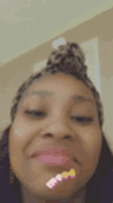 a close up of a woman 's face with a filter on her face .