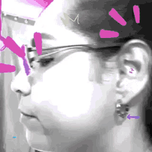 a drawing of a woman 's face and ear with a pink m on her forehead