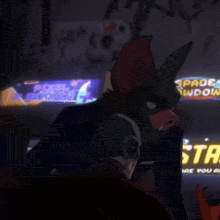 a man in a bat costume is standing in front of a sign that says space down