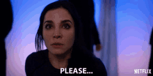 a woman says please in a dark room