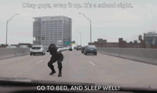 a man is dancing on the side of a highway with the words go to bed and sleep well