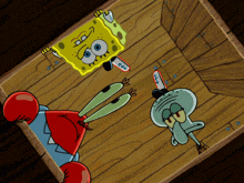 a cartoon of spongebob and squidward on a wooden floor