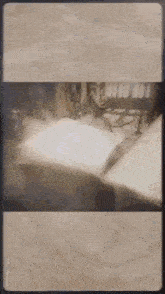 a blurred image of a person laying on a bed in a room