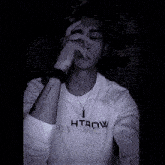 a picture of a man with his hands folded in front of him