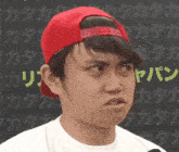 a man wearing a red hat and a white shirt says " do n't think "