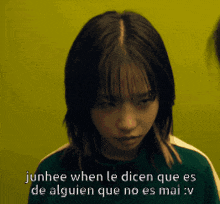 a girl with the words junhee when le dicen que es de alguien que no es mai