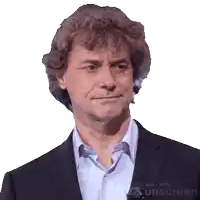 a man in a suit and white shirt is made with sunscreen