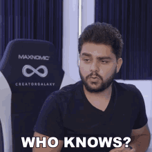 a man in a black shirt says who knows
