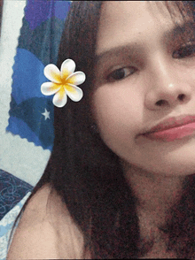 a woman with a flower in her hair