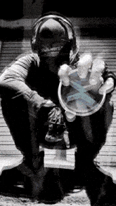a black and white photo of a man wearing headphones that say multiverse