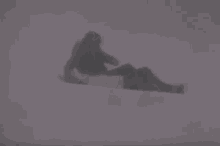 a man and a woman hugging each other in a dark room