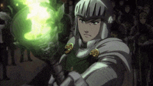 a man in armor holds a torch with a green flame coming out of it