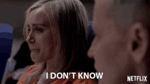 a woman says i don 't know while sitting next to a man