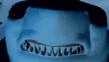 a close up of a person 's face with a shark 's teeth on it .
