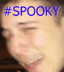 a close up of a person 's face with the words spooky written on it